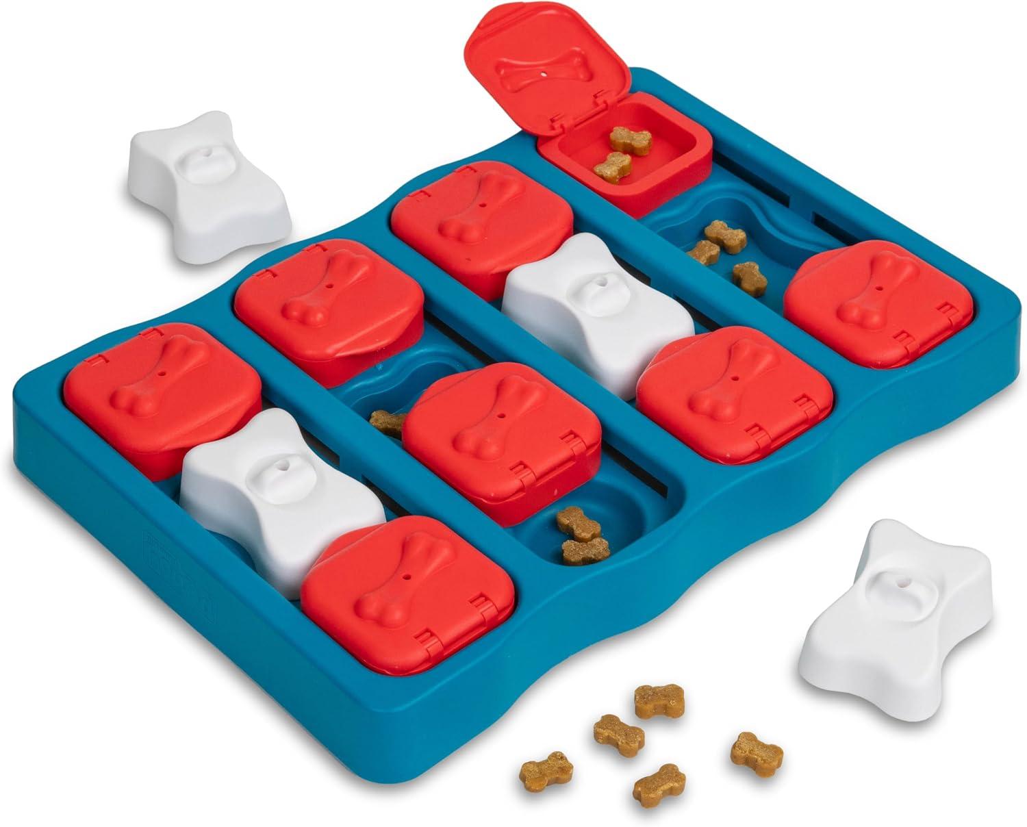 Level 2 interactive treat-dispensing puzzle game with sliding compartments.