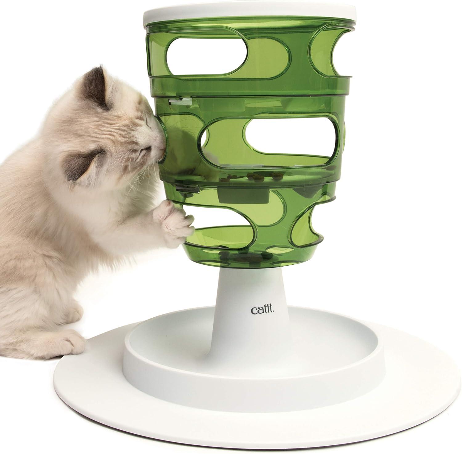Interactive puzzle feeding dish with vertical tubes for cats to paw food.